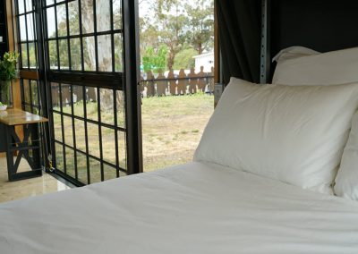 Queen size bed in deluxe cabin