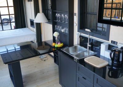 Nord Trond black kitchen with granite table